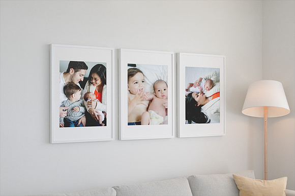 mockup-of-three-poster-frames-hanging-on-a-living-room-wall-560-el